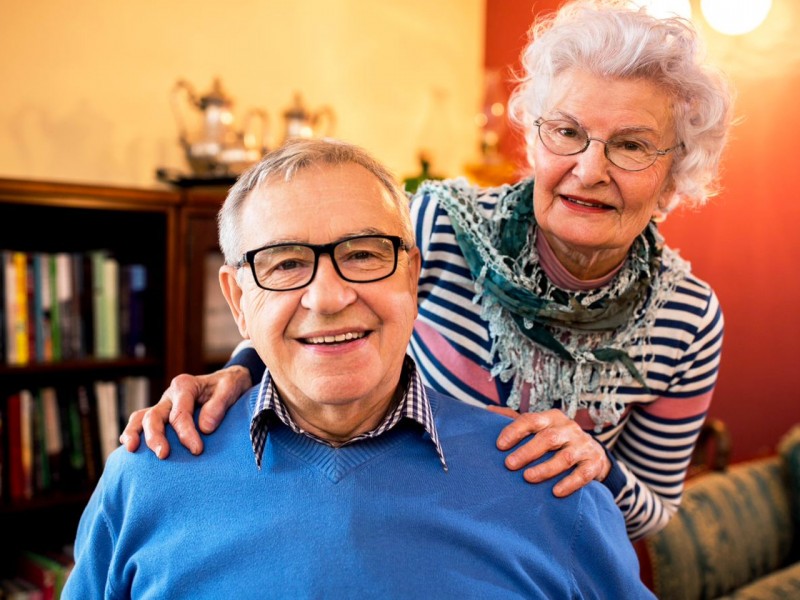 older coiple smiling
